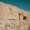 Heavy machinery in quarry. Building materials mining